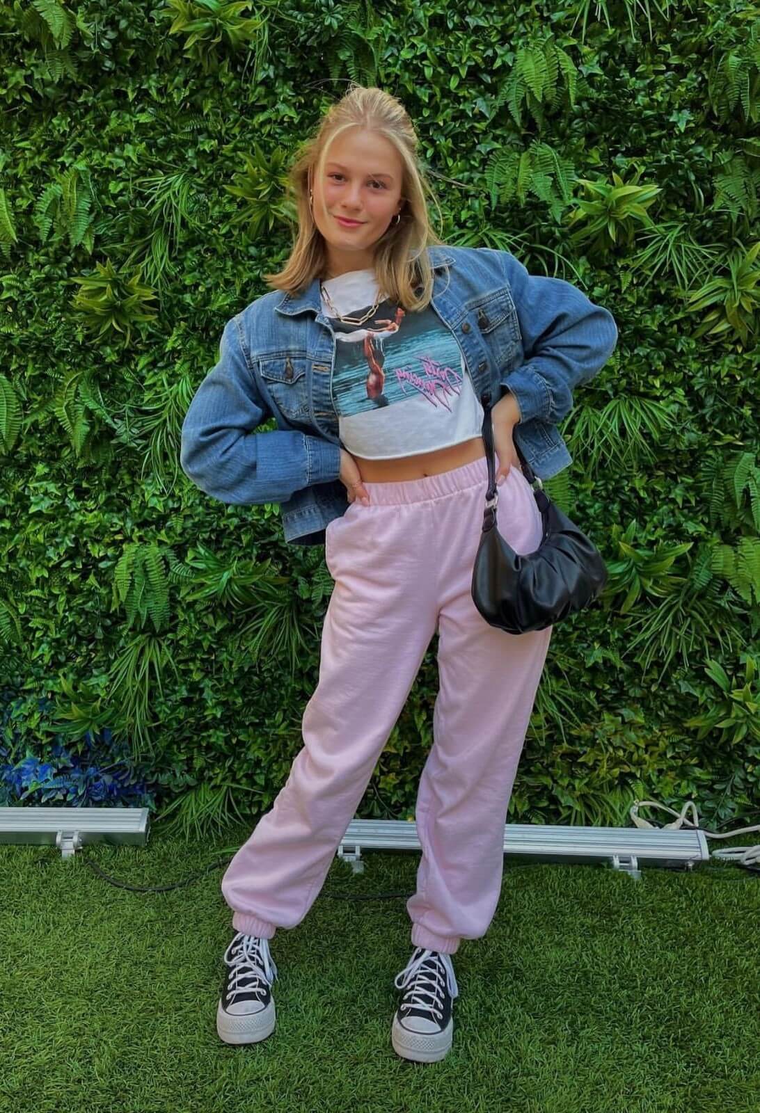 Darci Lynne Farmer In White Crop Top And Denim Jacket With Joggers