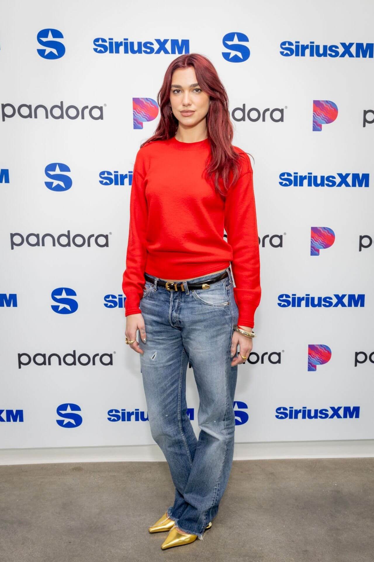 Dua Lipa In Red Pullover With Denim Jeans