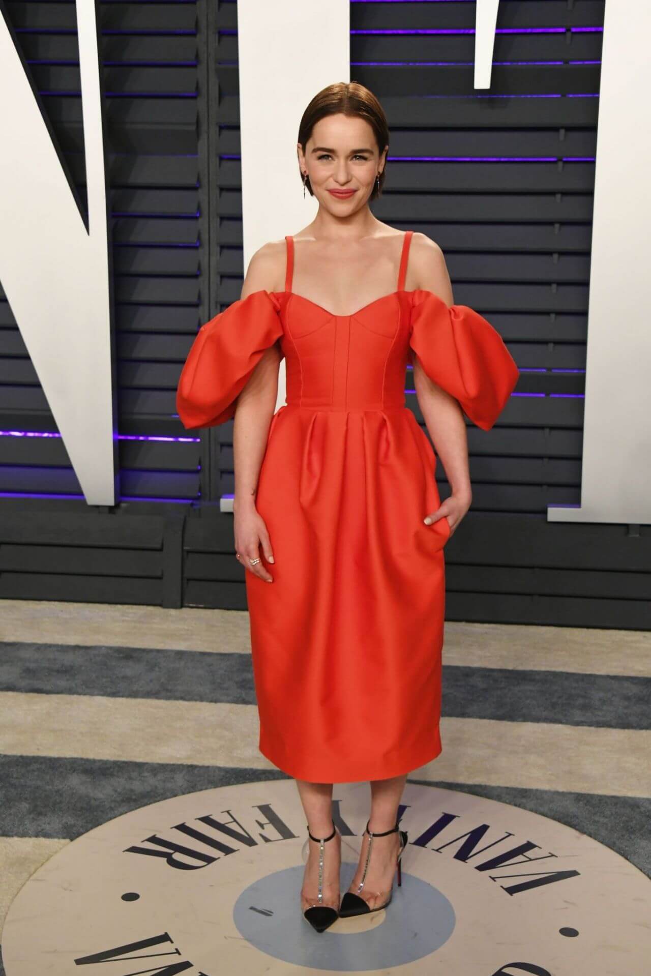 Emilia Clarke In Orange Baggy Sleeves Long Gown