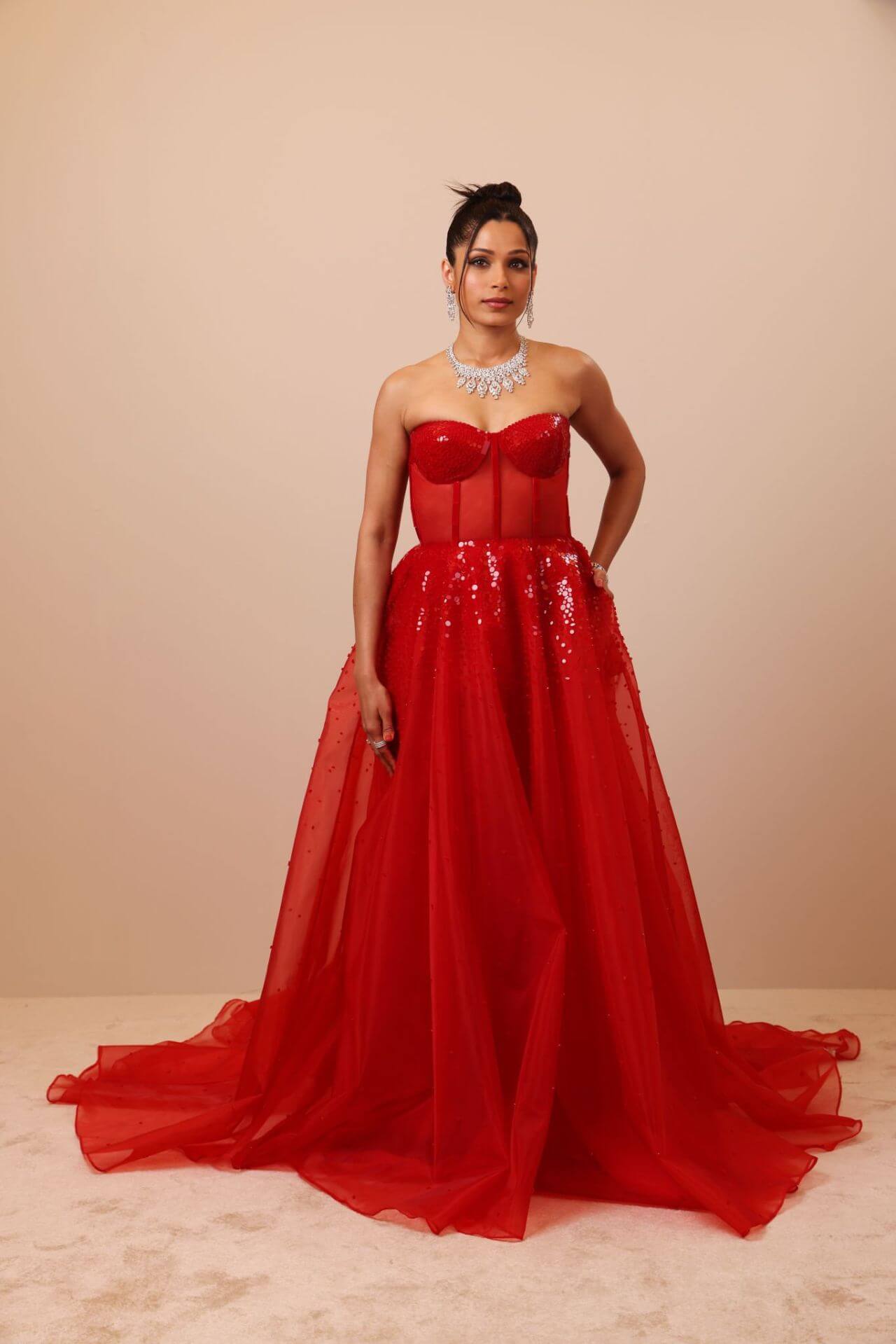 Freida Pinto In Red Shimmery Strapless Long Flare Gown