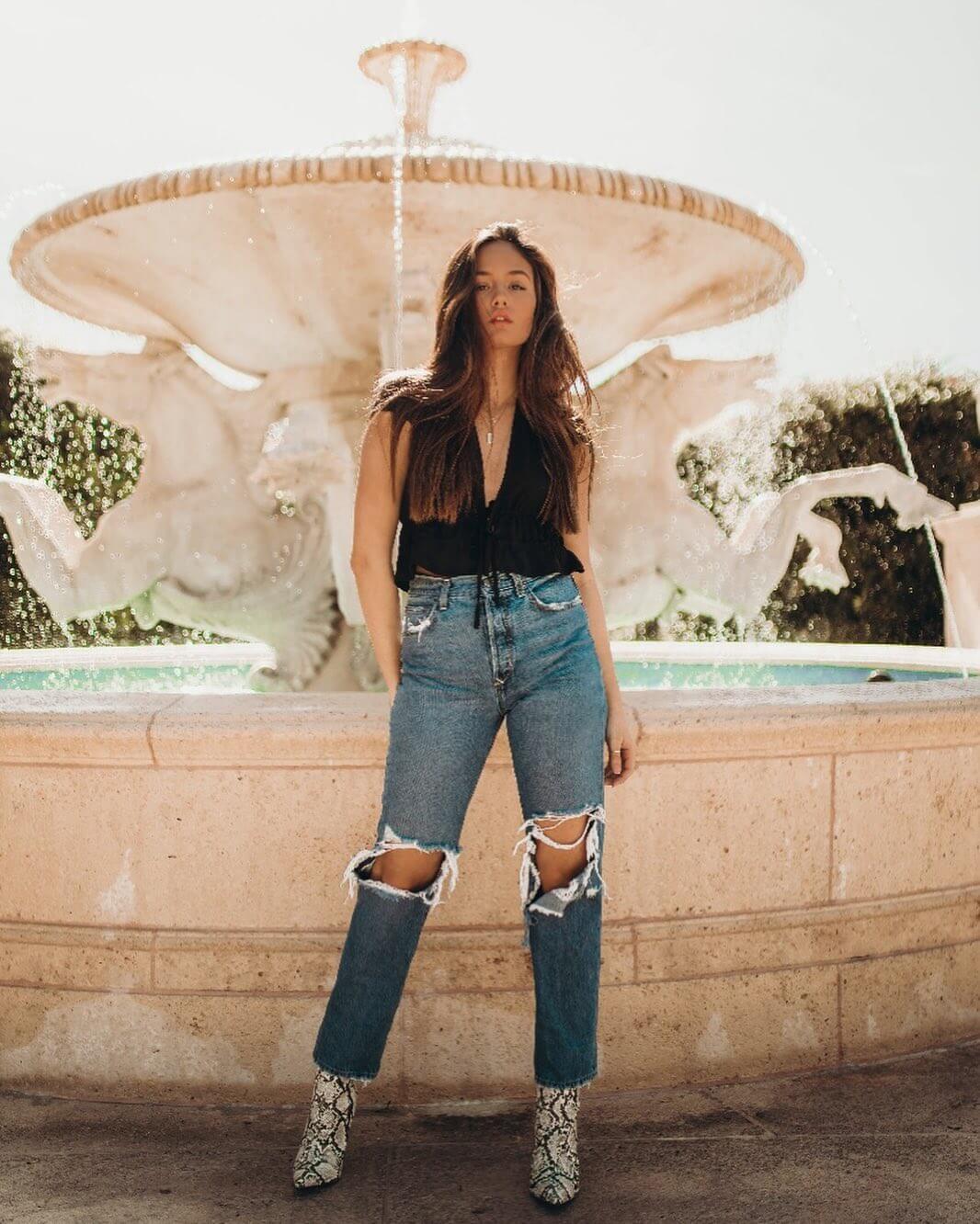 Makayla Storms In Black Top With Ripped Jeans