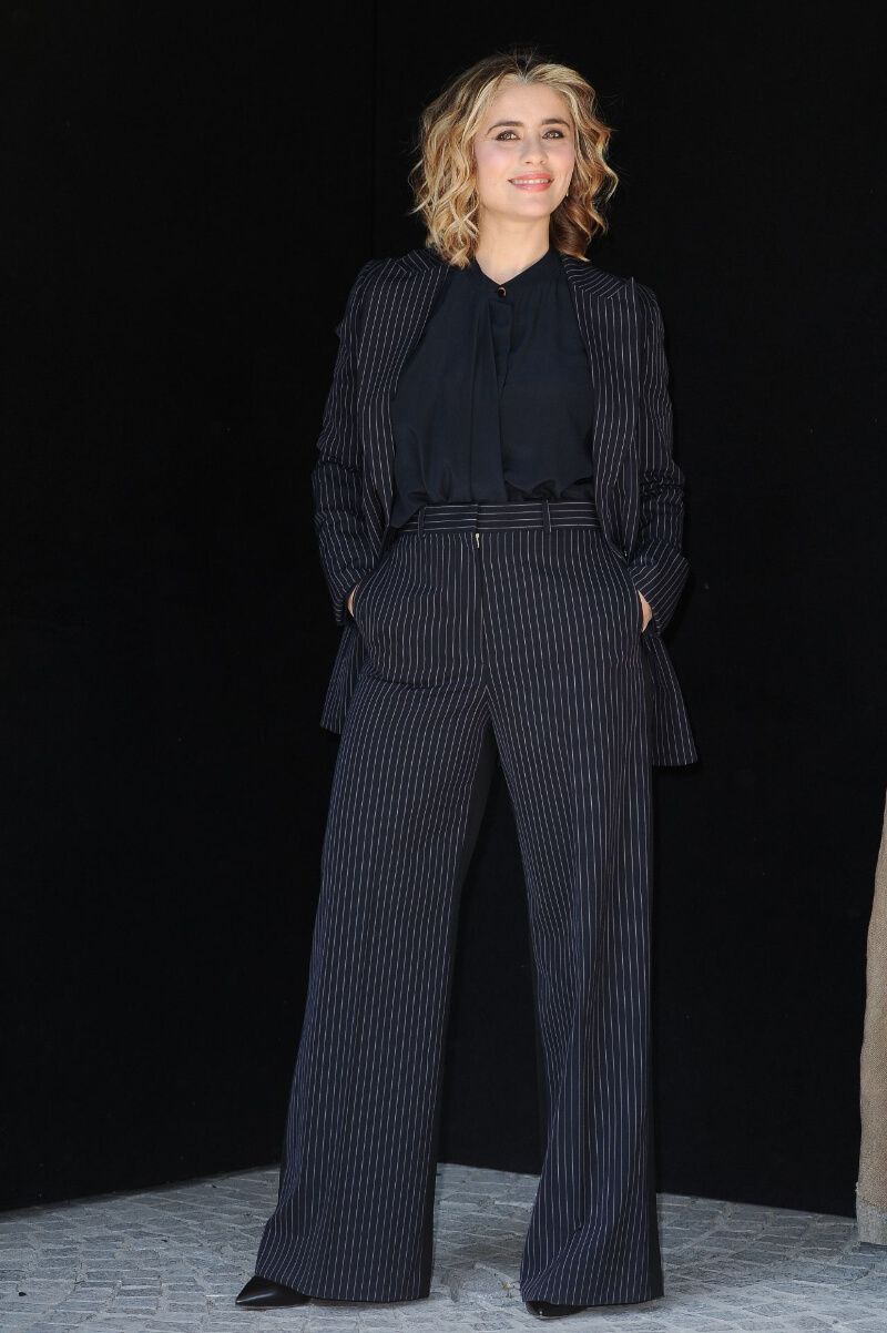 Greta Scarano In Striped Blazer and Pants With Black Top