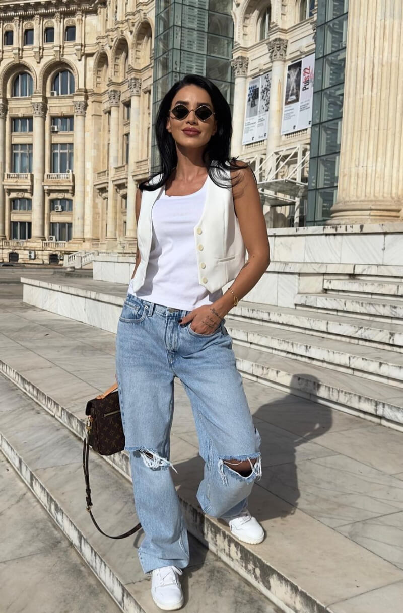 Adelina Pestritu In a White Top With Ripped Jeans