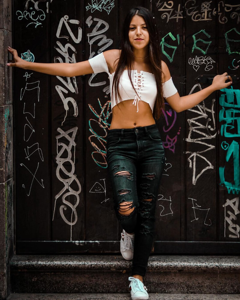 Ignaciaa Antonia In a White Crop Top With Ripped Jeans