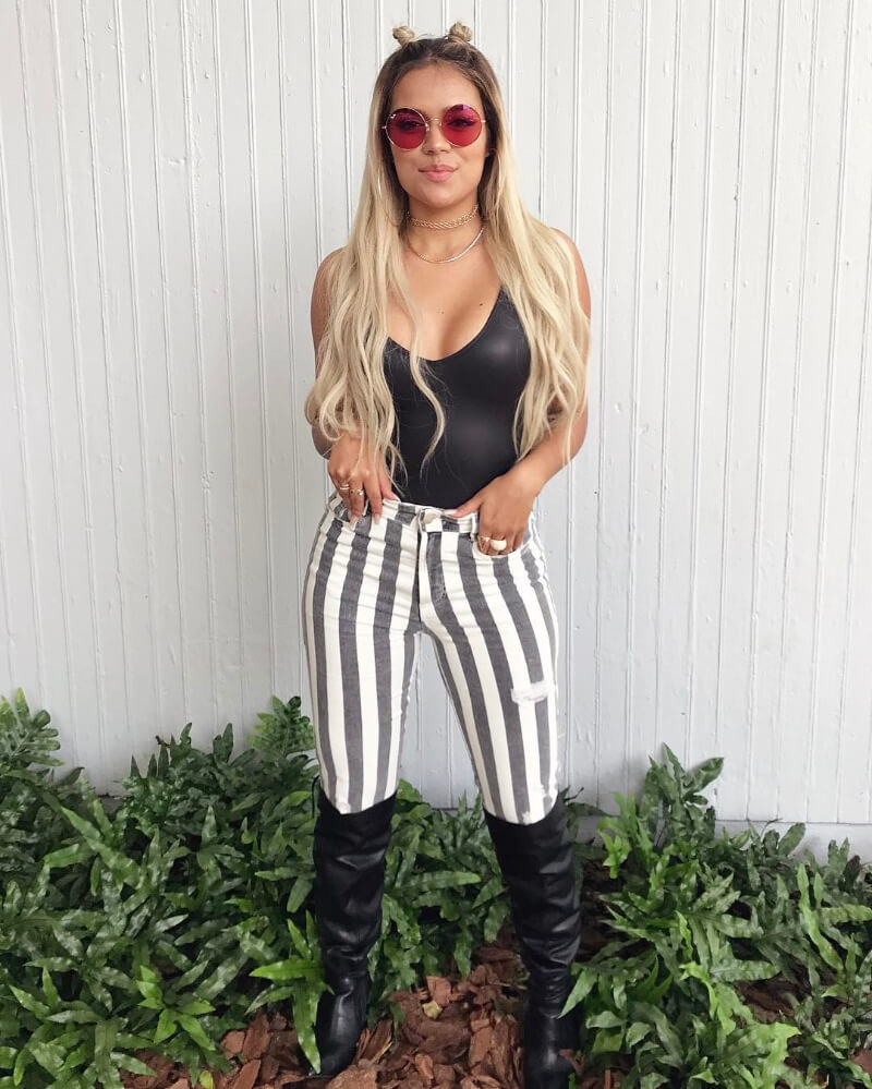 Karol G In Leather Top With Striped Pants