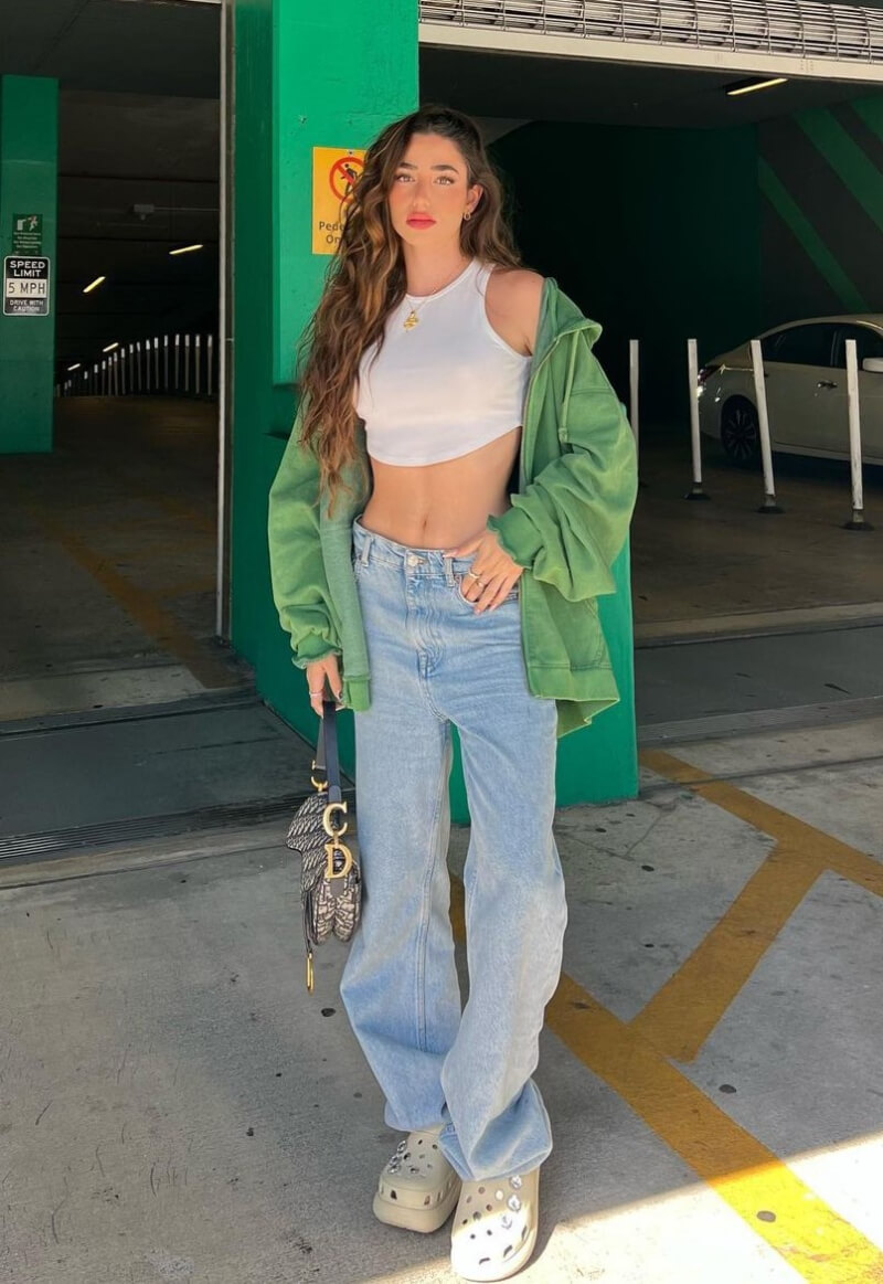 Lola Loliitaa In a White Crop Top and Jeans With a Jacket
