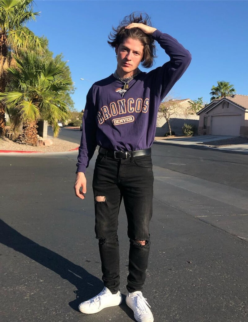 Ondreaz Lopez In Purple Pullover With Ripped Jeans