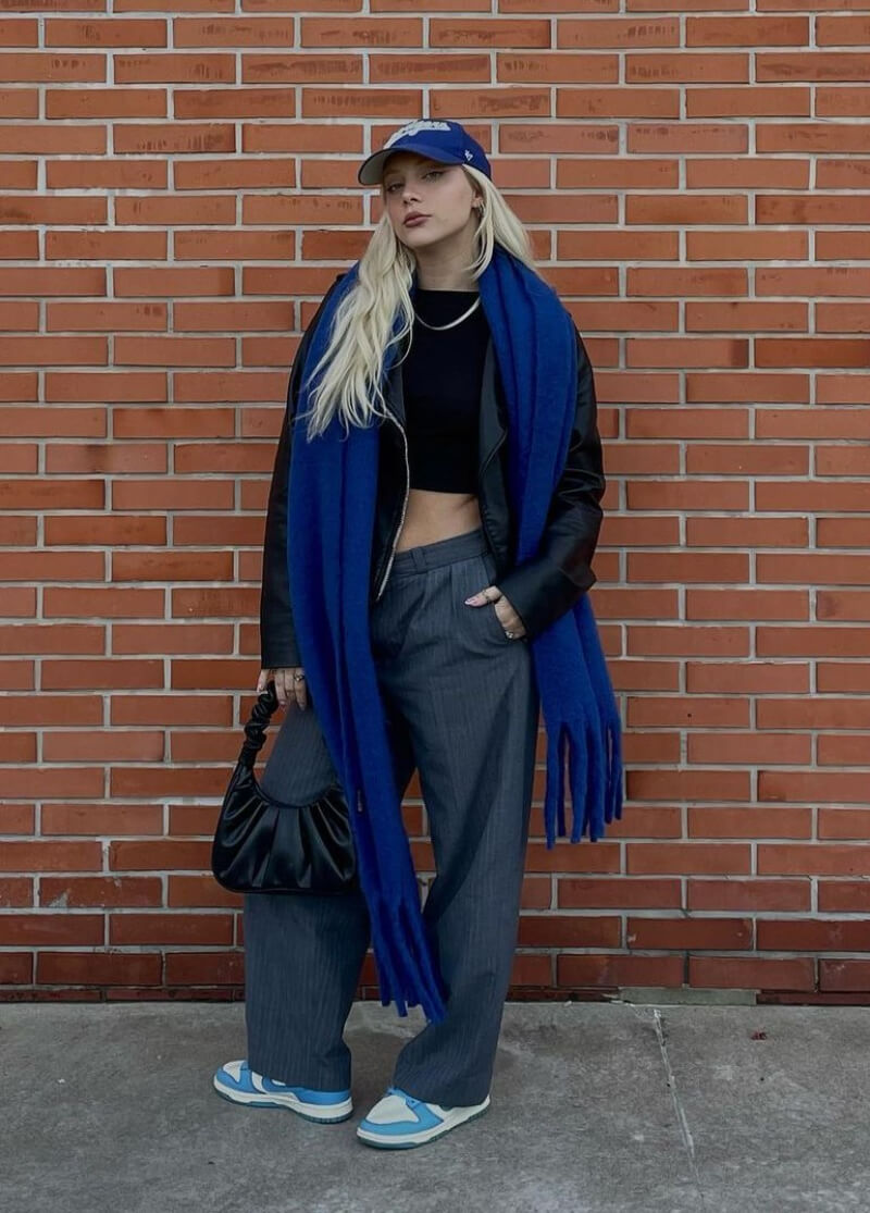 Ceci Roessler In Black Crop Top and Pants With Blue Shawl