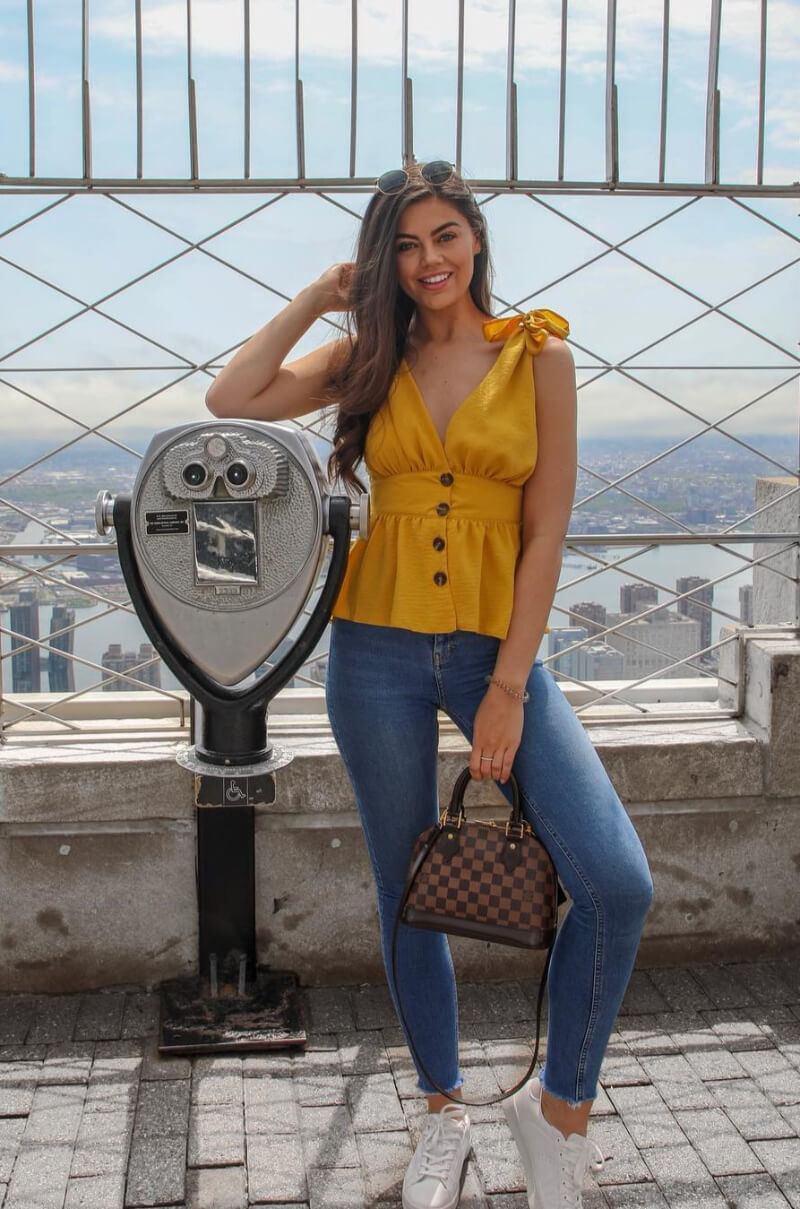 Emily Canham In Yellow Cami Top With Blue Jeans