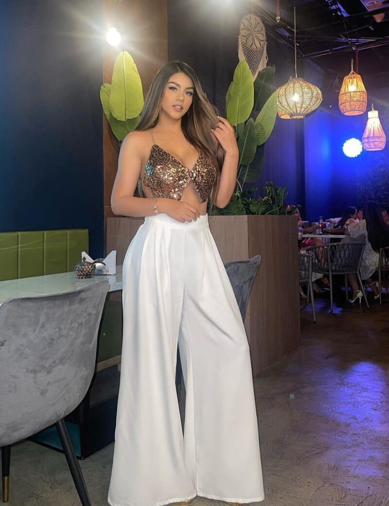 Melanie Janitsy In Golden Shimmery Bralette With Flare Pants