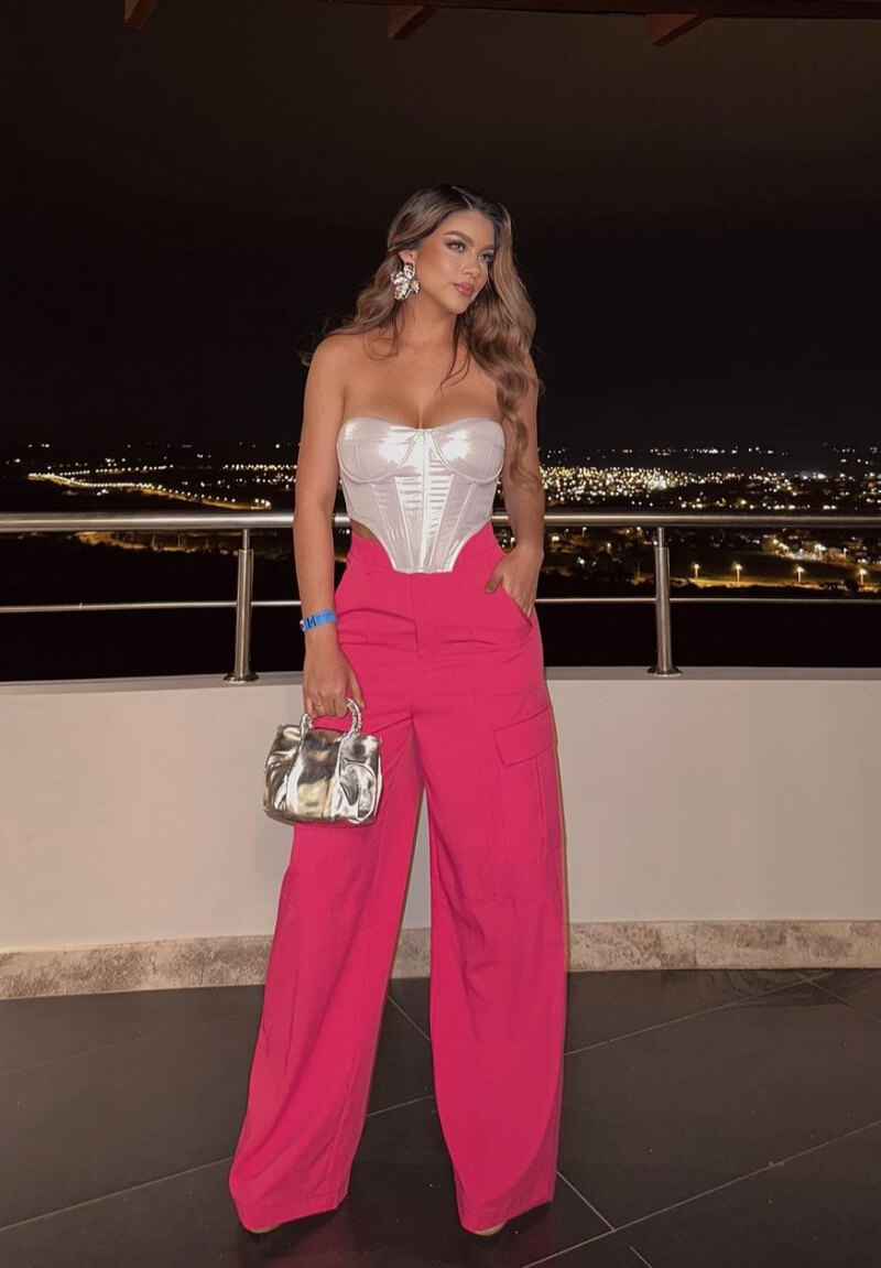 Melanie Janitsy In a White Strapless Top With Pink Pants