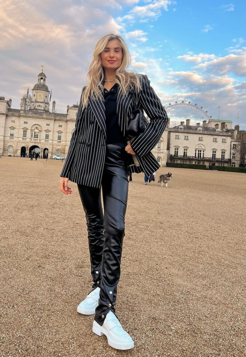 Xenia Adonts In a Black Striped Blazer With Leather Pants