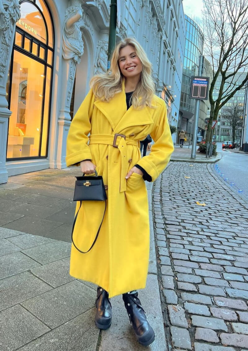 Xenia Adonts In Yellow Long Overcoat