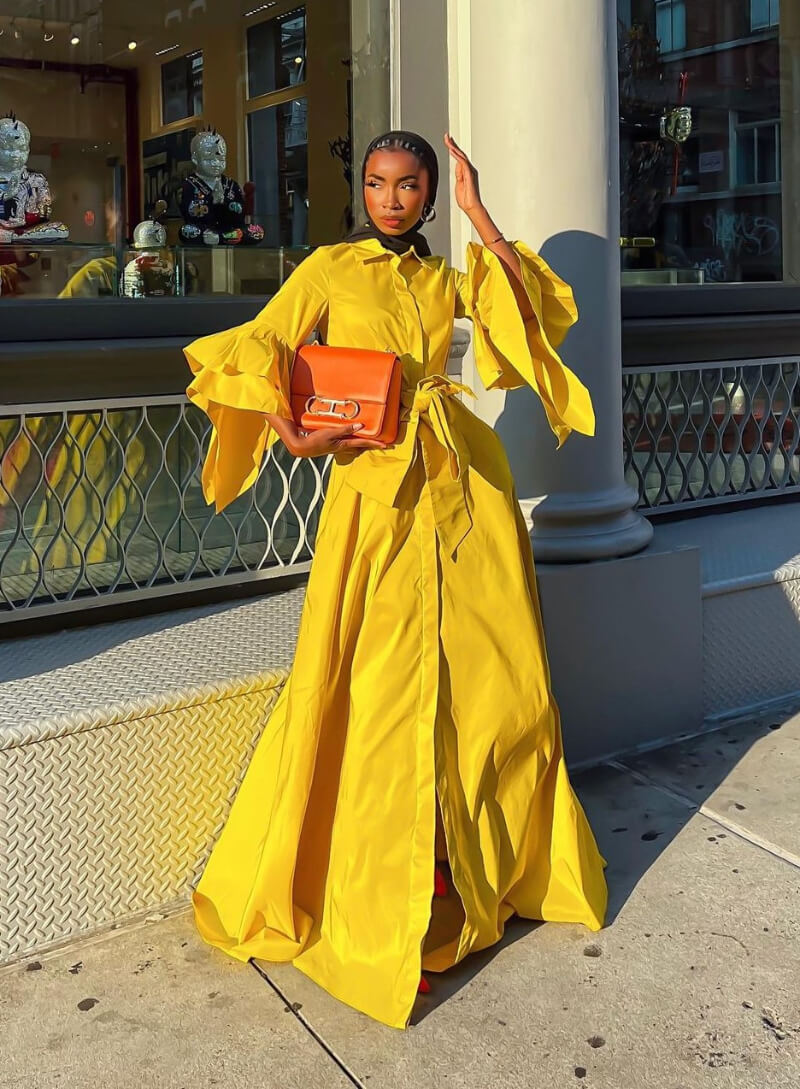 Aïssata Diallo In Yellow Flare Sleeves Long Dress