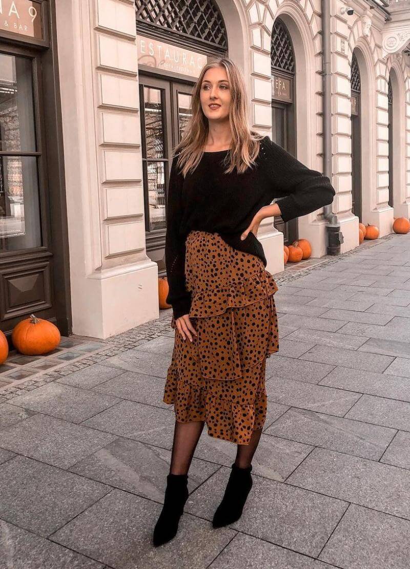 Marta Marczynska In Black Top With Printed Ruffle Skirt