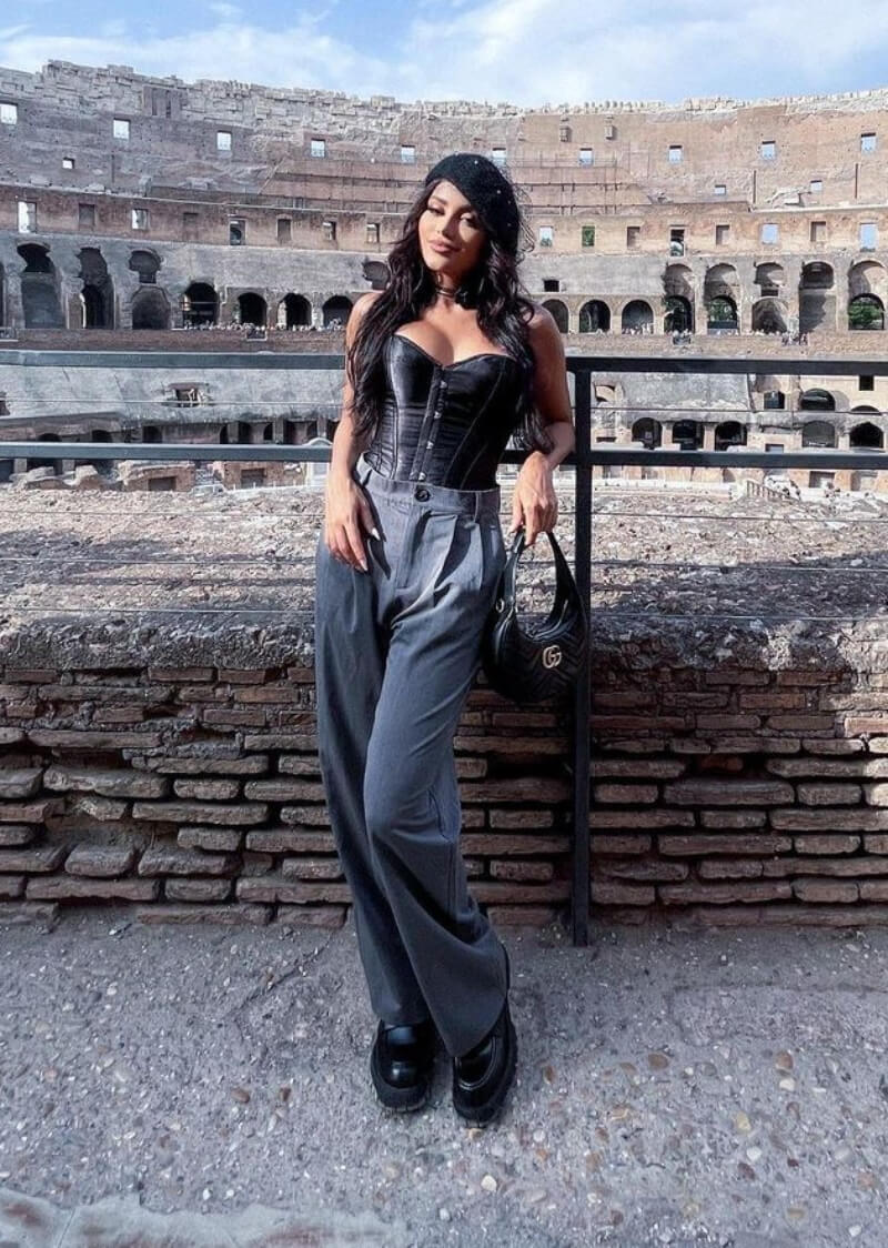 Nanda Caroll In a Black Strapless Top With Pants