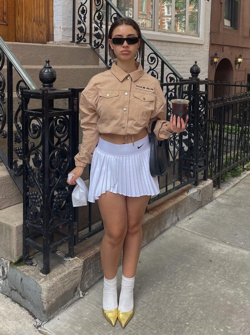 Sarah Mtimet In Beige Crop Shirt With Pleated Mini Skirt