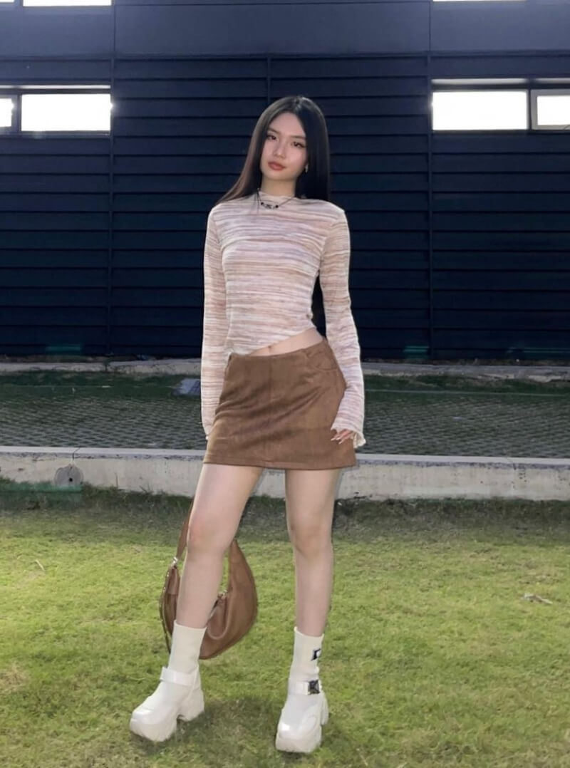 Thao Vy In Beige Full Sleeves Top With Mini Skirt