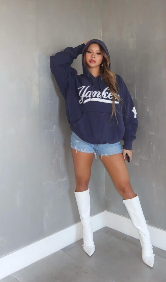 Tiana Musarra In Blue Sweatshirt With Denim Shorts