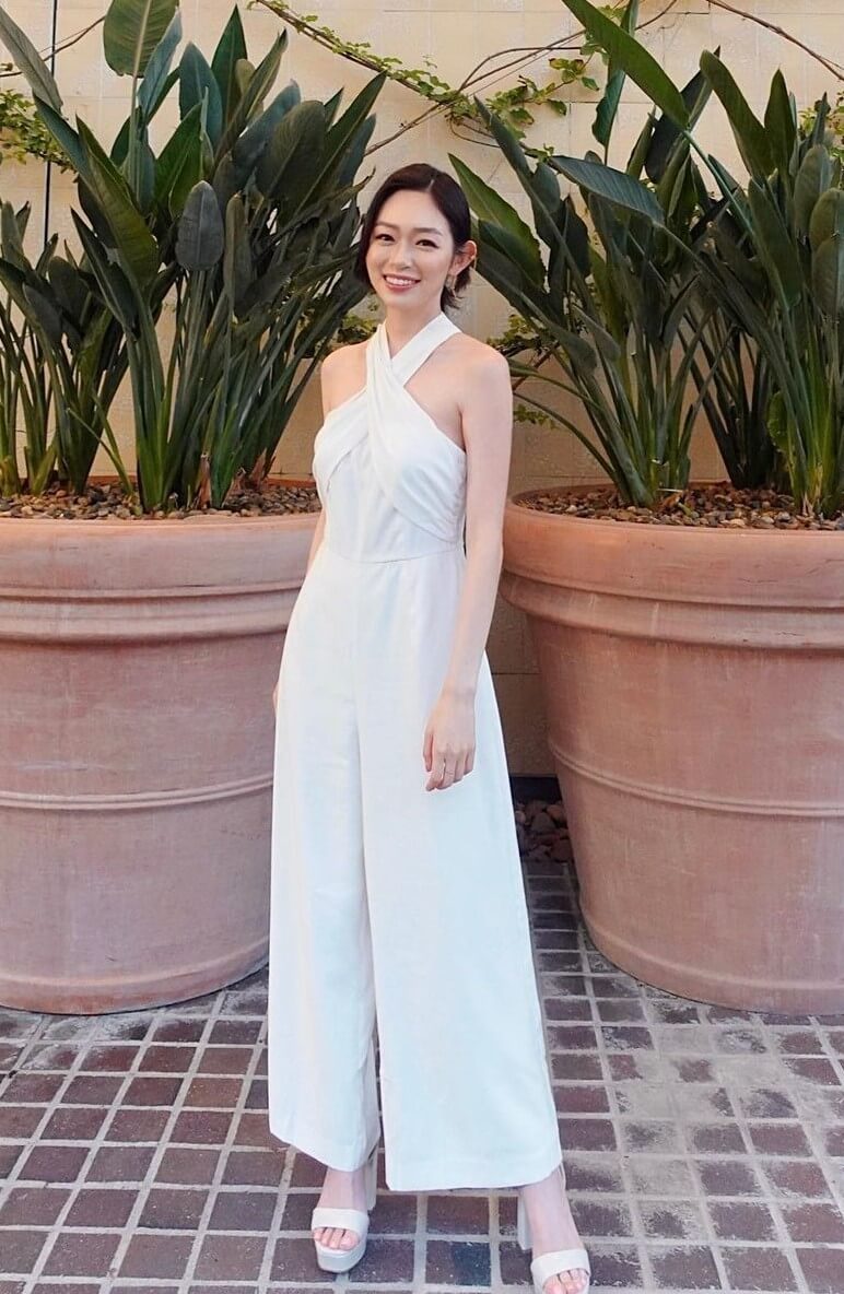Jasmine Cho In White Criss Cross Halter Jumpsuit