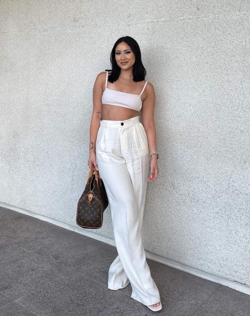 Brittney Bobay In a White Tank Top With Pants