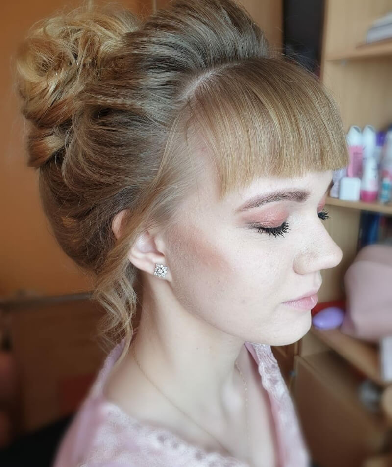 Blonde Front Flick Messy Bun Hairstyle