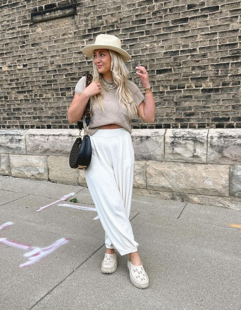 Brooke Anderson In a Woven Top With White Pants