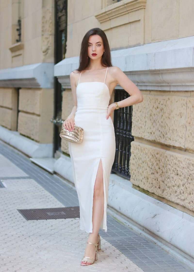 Susana Arcocha In White Strap Sleeves Slit Cut Outfit