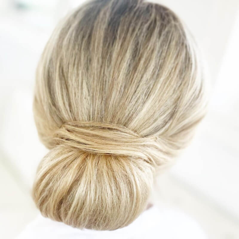 Blonde Texture Tucked Low Bun Hairstyle