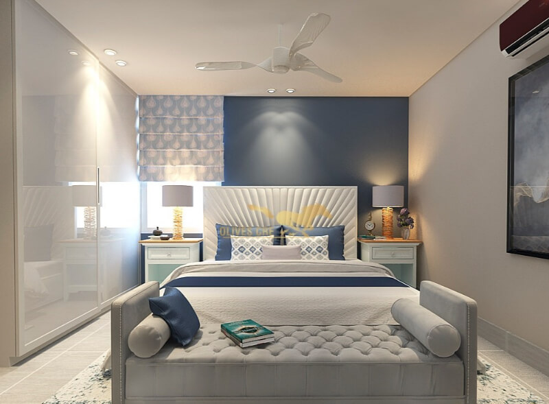 The Penthouse Features A Guest Room In shades Of Grey And Blue